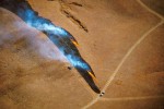 Photograph entitled Lighting a back-fire
